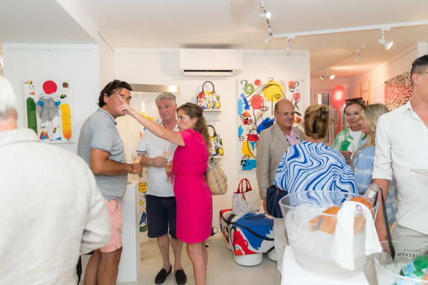People inside of Carousel Fine Art's gallery space in Saint Tropez.