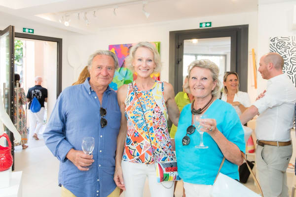 People inside of Carousel Fine Art's gallery space in Saint Tropez.