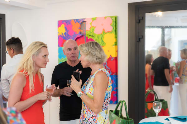 People inside of Carousel Fine Art's gallery space in Saint Tropez.