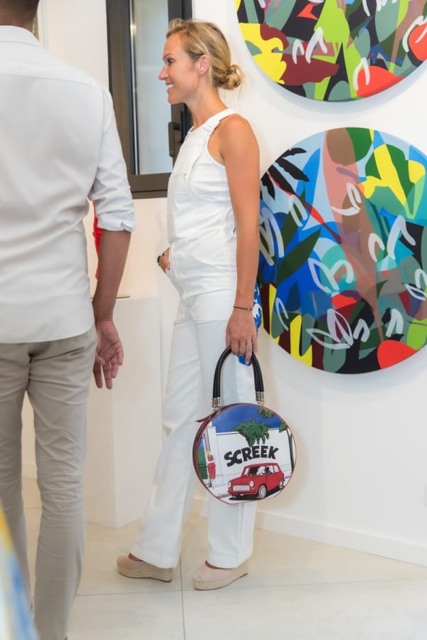 People inside of Carousel Fine Art's gallery space in Saint Tropez.