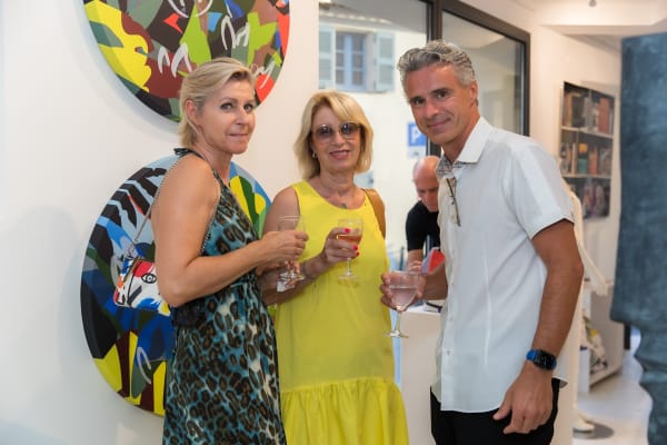 People inside of Carousel Fine Art's gallery space in Saint Tropez.