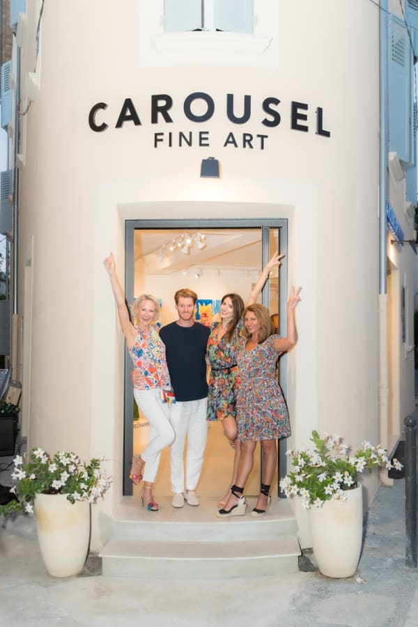 Carousel Fine Art owners posing outside of Carousel Fine Art's gallery space in Saint Tropez.