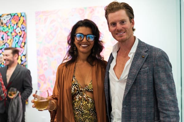 People posing in Carousel Fine Art's Miami gallery space during the Grand Opening.