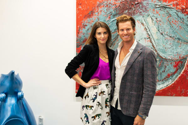 Owners of Carousel Fine Art posing in Carousel Fine Art's Miami gallery space during the Grand Opening.