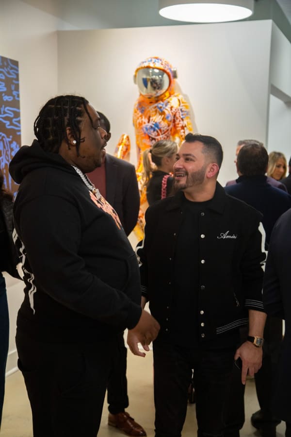 People at Carousel Fine Art's new gallery space in Buckhead Village, Atlanta during an event for their grand opening.