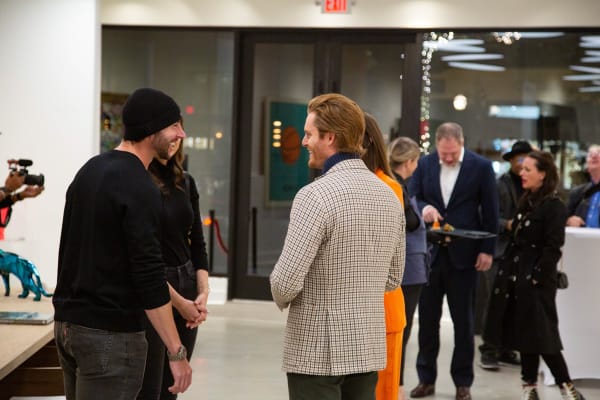 People in Carousel Fine Art's new gallery space in Buckhead Village, Atlanta during an event for their grand opening.