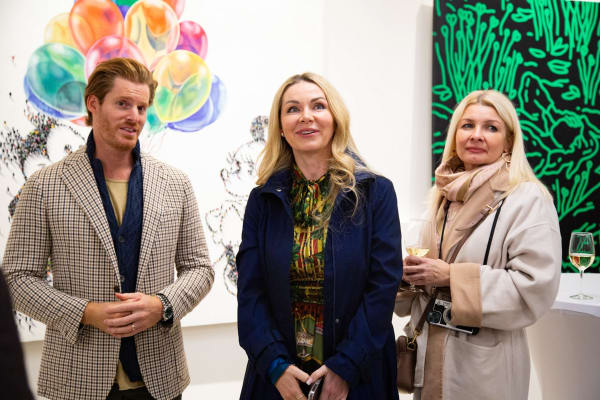 People at Carousel Fine Art's new gallery space in Buckhead Village, Atlanta during an event for their grand opening.