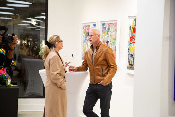 People at Carousel Fine Art's new gallery space in Buckhead Village, Atlanta during an event for their grand opening.