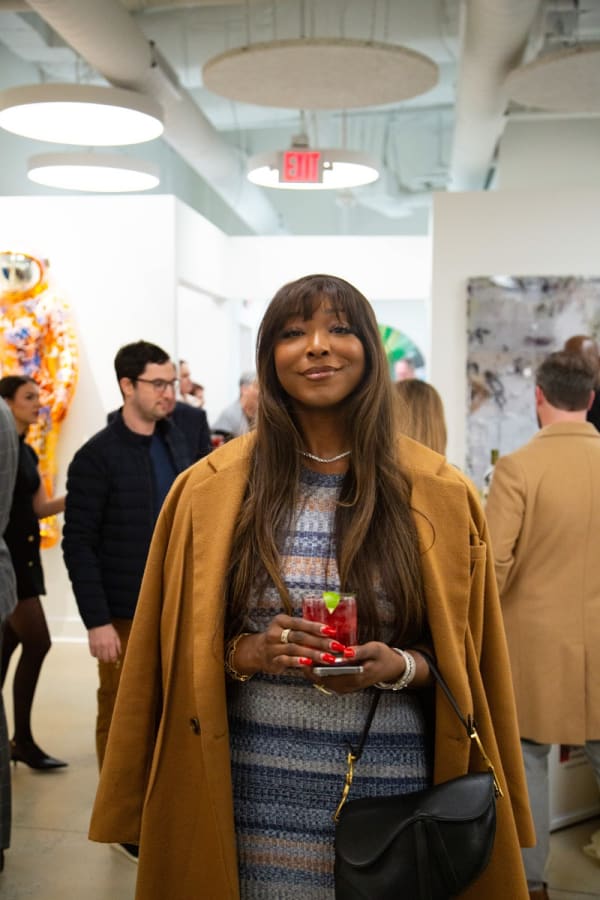 Woman at Carousel Fine Art's new gallery space in Buckhead Village, Atlanta during an event for their grand opening.