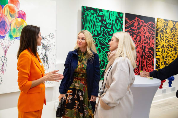 People at Carousel Fine Art's new gallery space in Buckhead Village, Atlanta during an event for their grand opening.