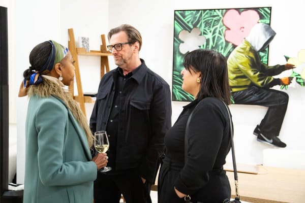 People at Carousel Fine Art's new gallery space in Buckhead Village, Atlanta during an event for their grand opening.