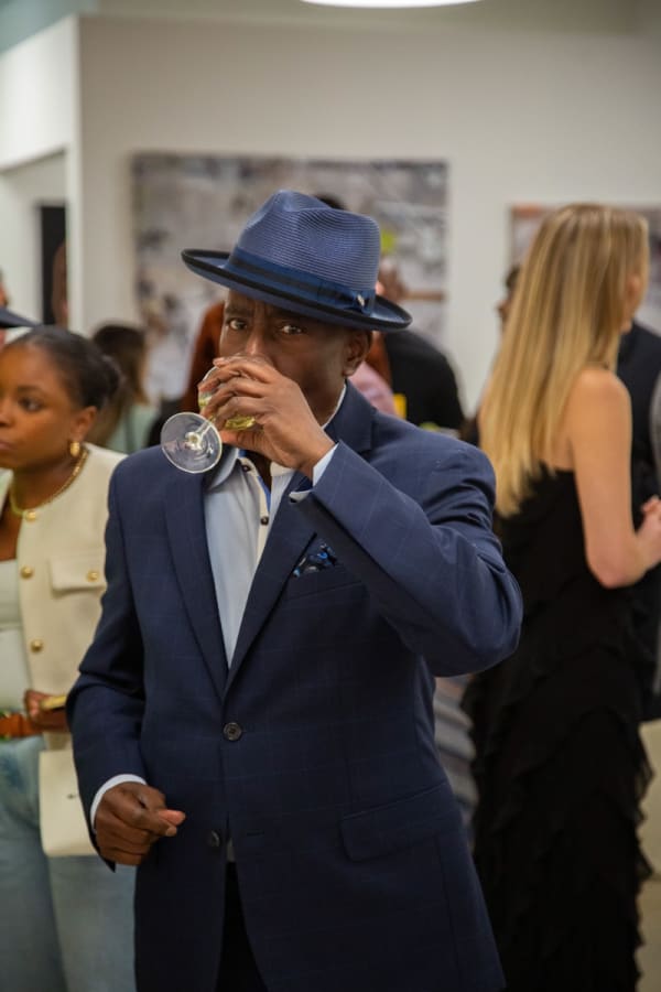 People at Carousel Fine Art's new gallery space in Buckhead Village, Atlanta during an event for their grand opening.