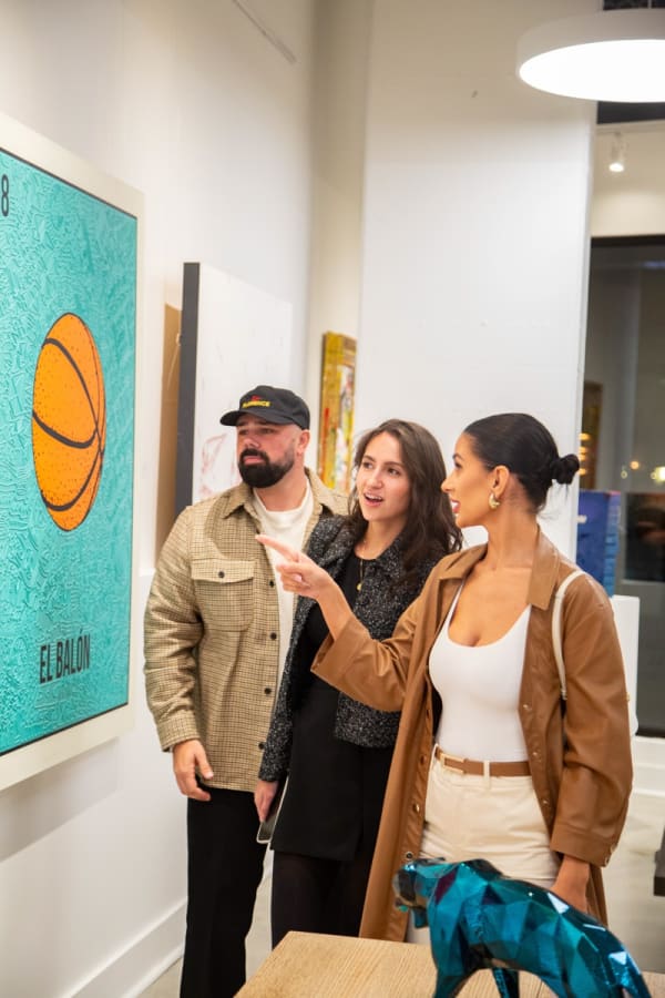 People at Carousel Fine Art's new gallery space in Buckhead Village, Atlanta during an event for their grand opening.