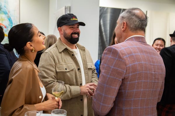 People at Carousel Fine Art's new gallery space in Buckhead Village, Atlanta during an event for their grand opening.