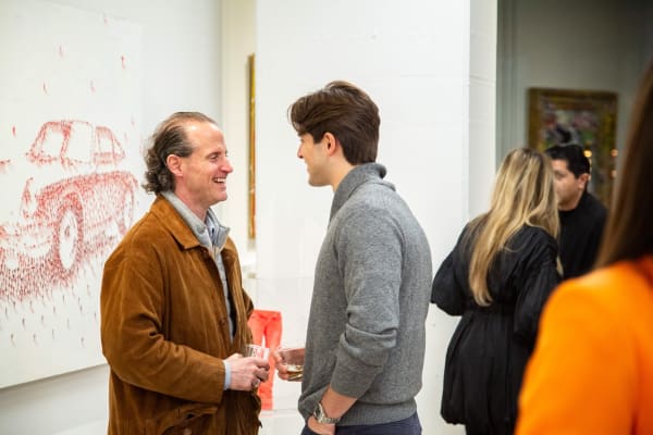 People at Carousel Fine Art's new gallery space in Buckhead Village, Atlanta during an event for their grand opening.