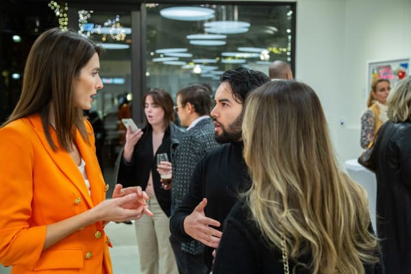 People at Carousel Fine Art's new gallery space in Buckhead Village, Atlanta during an event for their grand opening.