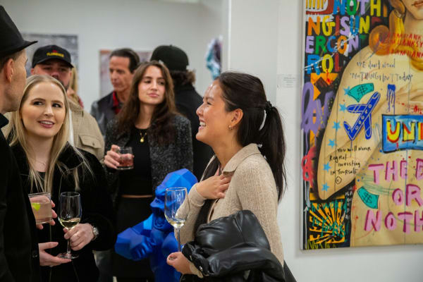 People at Carousel Fine Art's new gallery space in Buckhead Village, Atlanta during an event for their grand opening.