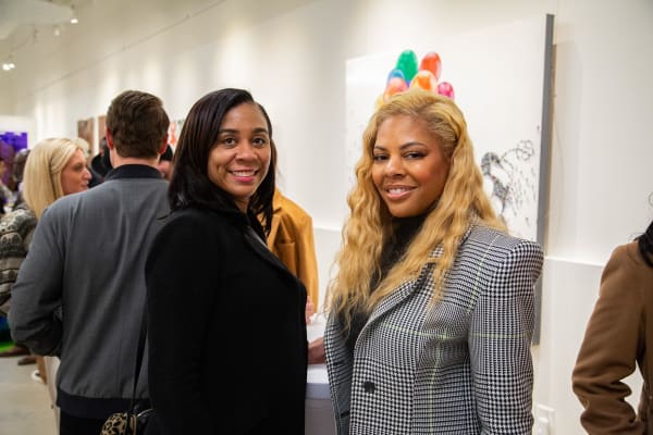 People at Carousel Fine Art's new gallery space in Buckhead Village, Atlanta during an event for their grand opening.