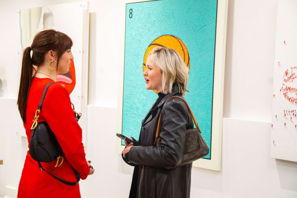 People at Carousel Fine Art's new gallery space in Buckhead Village, Atlanta during an event for their grand opening.