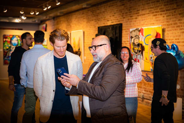 People in Carousel Fine Art's Chicago gallery space.
