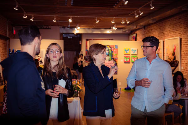 People in Carousel Fine Art's Chicago gallery space.