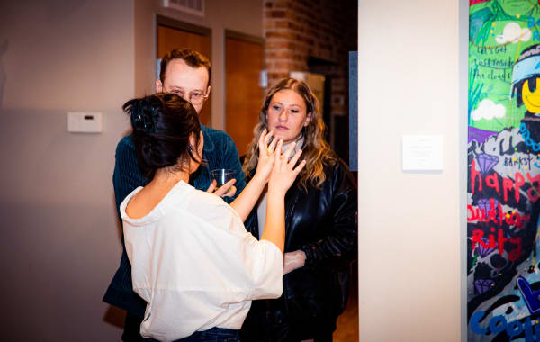 People in Carousel Fine Art's Chicago gallery space.