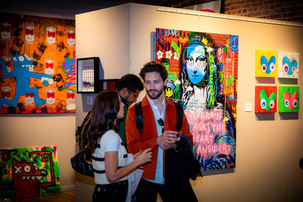 People in Carousel Fine Art's Chicago gallery space.