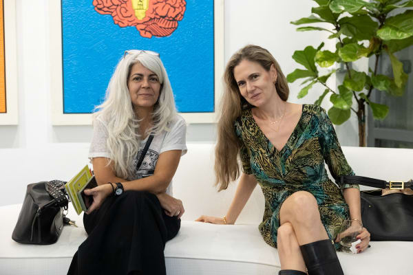 People in Carousel Fine Art's Miami location for the Cayla Birk exhibition, "It's in the Cards."
