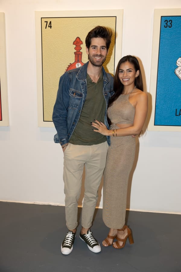 People in Carousel Fine Art's Miami location for the Cayla Birk exhibition, "It's in the Cards."