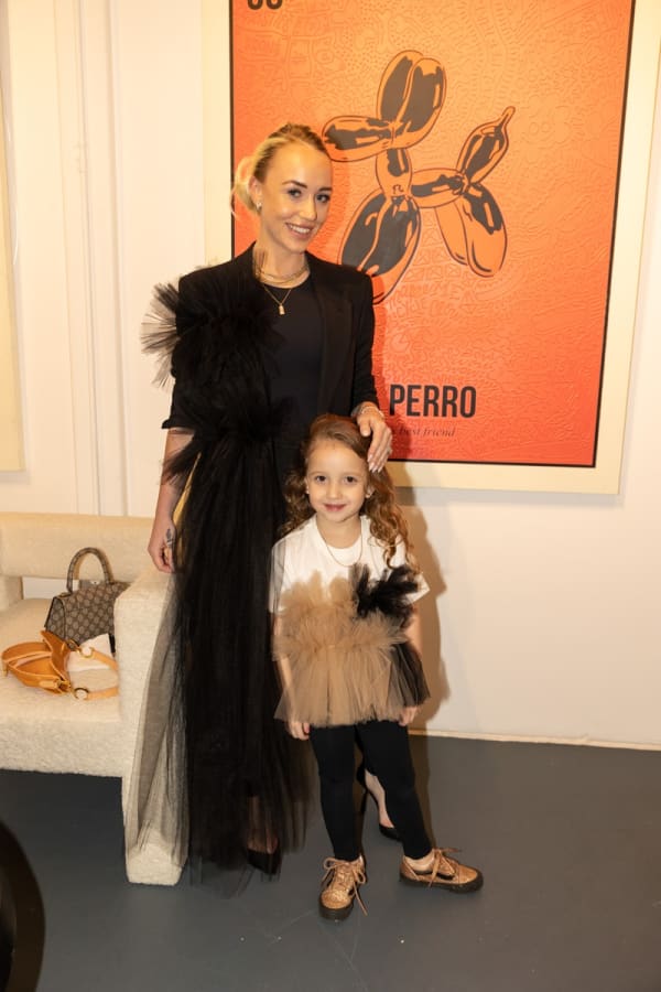 People in Carousel Fine Art's Miami location for the Cayla Birk exhibition, "It's in the Cards."