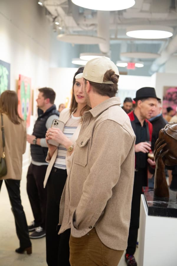 People in Carousel Fine Art's Atlanta gallery space during the spotlight exhibition for John Westbay titled "Love, Outside the Lines."