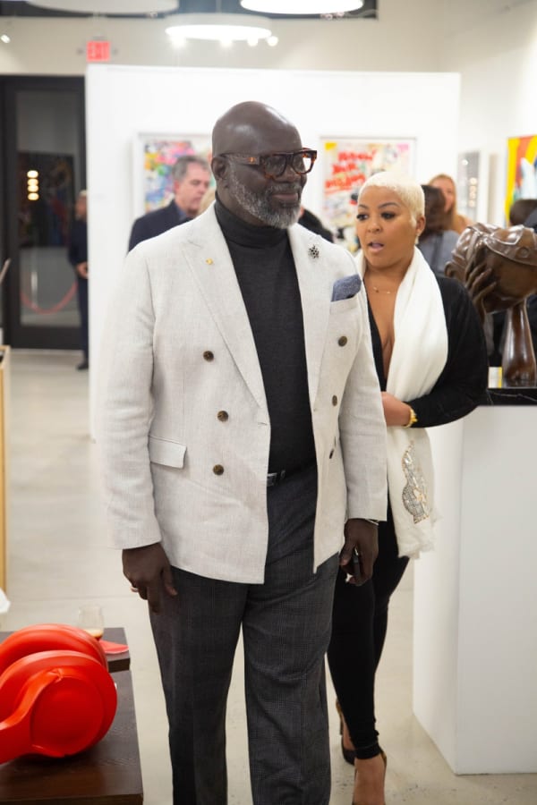 Man in Carousel Fine Art's Atlanta gallery space during the spotlight exhibition for John Westbay titled "Love, Outside the Lines."