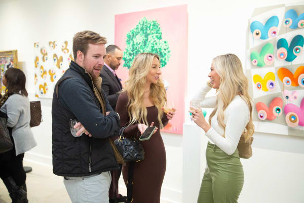 People in Carousel Fine Art's Atlanta gallery space during the spotlight exhibition for John Westbay titled "Love, Outside the Lines."