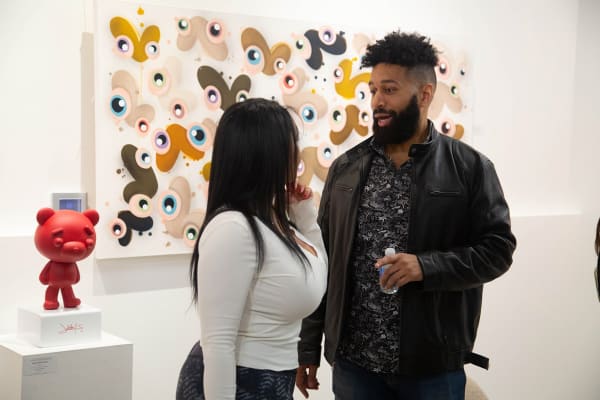 People in Carousel Fine Art's Atlanta gallery space during the spotlight exhibition for John Westbay titled "Love, Outside the Lines."