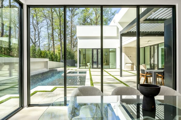 Interior of a luxury modern home in Atlanta, GA looking out onto the exterior.