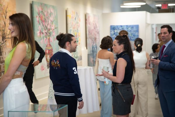 People in Carousel Fine Art's Buckhead Village gallery location during the art exhibition for Eric Alfaro, "Spring Reverie."