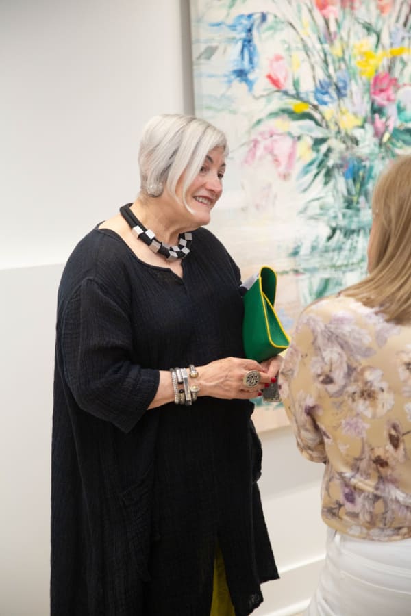 People in Carousel Fine Art's Buckhead Village location during the Eric Alfaro exhibition "Spring Reverie."