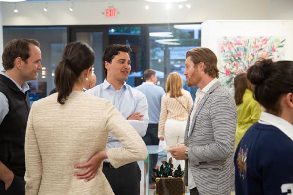 People in Carousel Fine Art's Buckhead Village location during the Eric Alfaro exhibition "Spring Reverie."