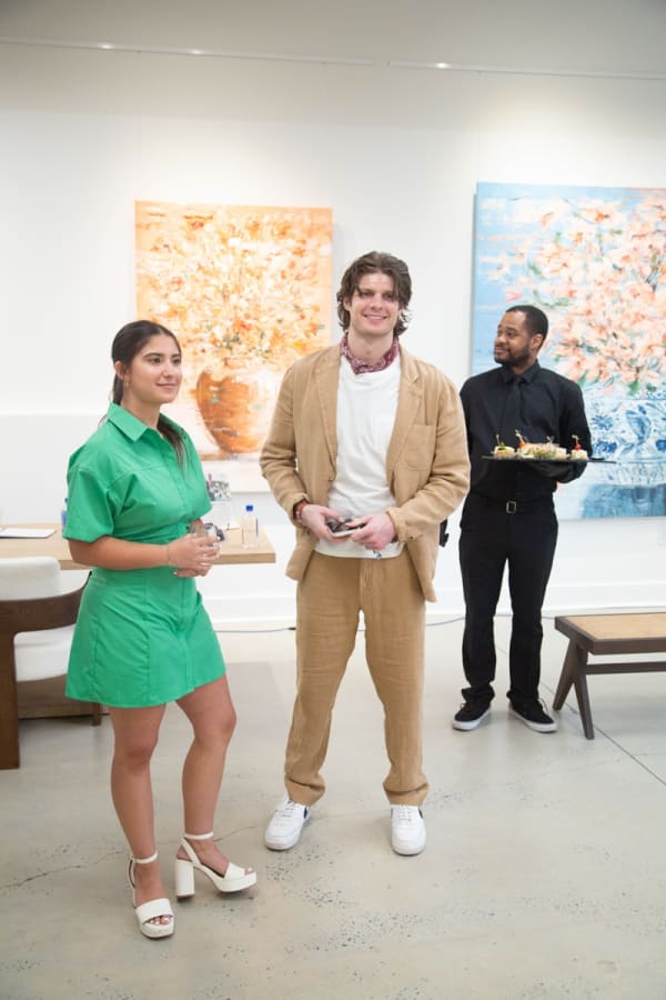 People inside Carousel Fine Art's Buckhead Village location during the Eric Alfaro exhibition "Spring Reverie."