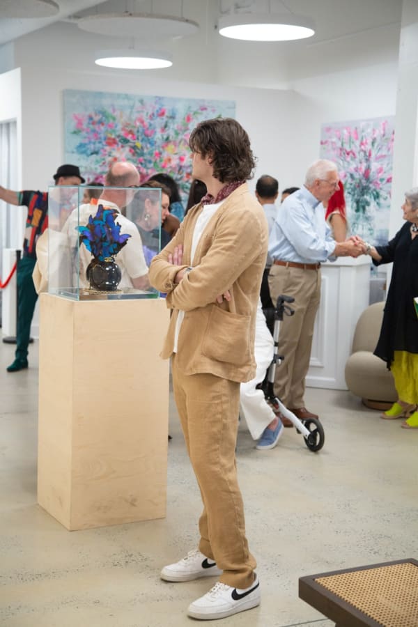 People in Carousel Fine Art's Buckhead Village location during the Eric Alfaro exhibition "Spring Reverie."