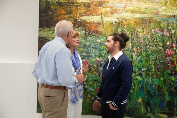 People in Carousel Fine Art's Buckhead Village location during the Eric Alfaro exhibition "Spring Reverie."