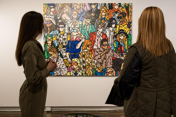 People at a Chicago art event, a solo exhibition for artist Chance Cooper titled "Action!", hosted by Chicago art gallery Carousel Fine Art.