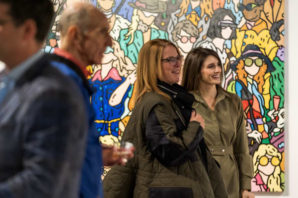 People at a Chicago art event, a solo exhibition for artist Chance Cooper titled "Action!", hosted by Chicago art gallery Carousel Fine Art.