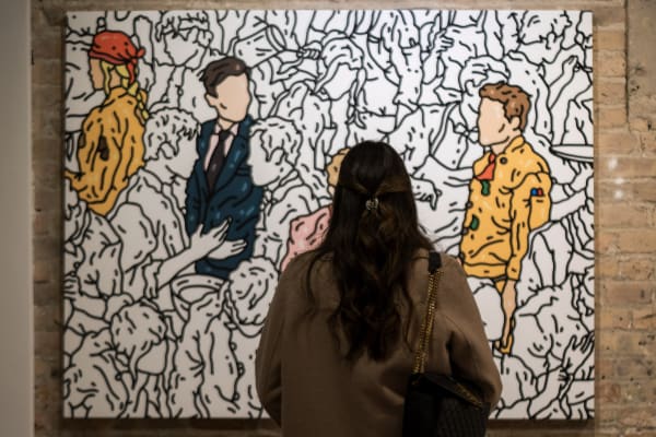 People at a Chicago art event, a solo exhibition for artist Chance Cooper titled "Action!", hosted by Chicago art gallery Carousel Fine Art.
