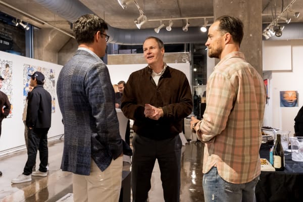 People at a Chicago art event, a solo exhibition for artist Chance Cooper titled "Action!", hosted by Chicago art gallery Carousel Fine Art.