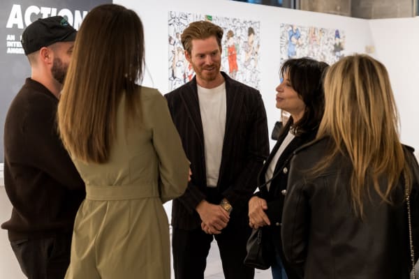 People at a Chicago art event, a solo exhibition for artist Chance Cooper titled "Action!", hosted by Chicago art gallery Carousel Fine Art.