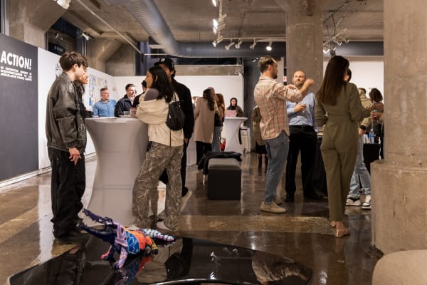 People at a Chicago art event, a solo exhibition for artist Chance Cooper titled "Action!", hosted by Chicago art gallery Carousel Fine Art.