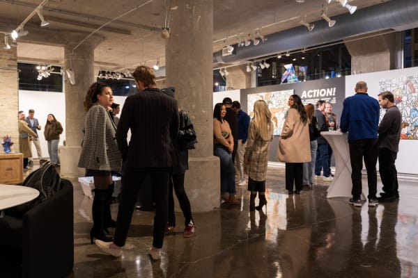 People at a Chicago art event, a solo exhibition for artist Chance Cooper titled "Action!", hosted by Chicago art gallery Carousel Fine Art.