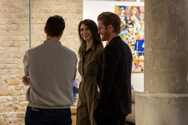 People at a Chicago art event, a solo exhibition for artist Chance Cooper titled "Action!", hosted by Chicago art gallery Carousel Fine Art.