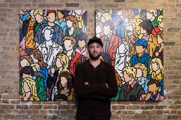 People at a Chicago art event, a solo exhibition for artist Chance Cooper titled "Action!", hosted by Chicago art gallery Carousel Fine Art.